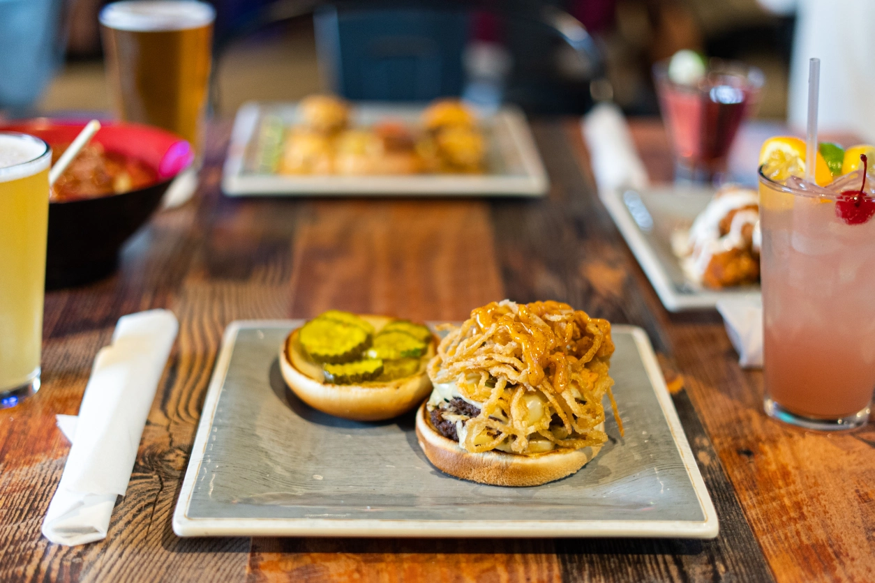 Burger with crispy onions and pickles.