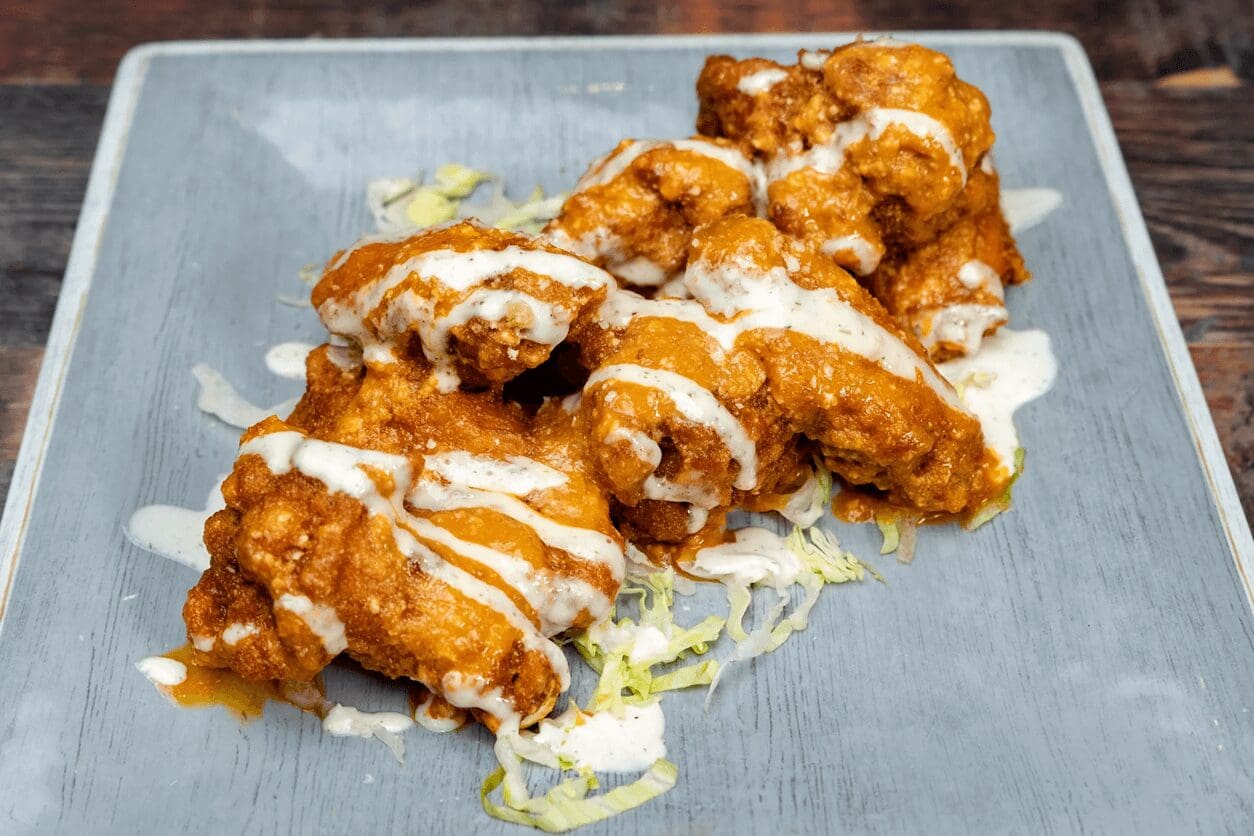 Spicy chicken wings with ranch dressing.