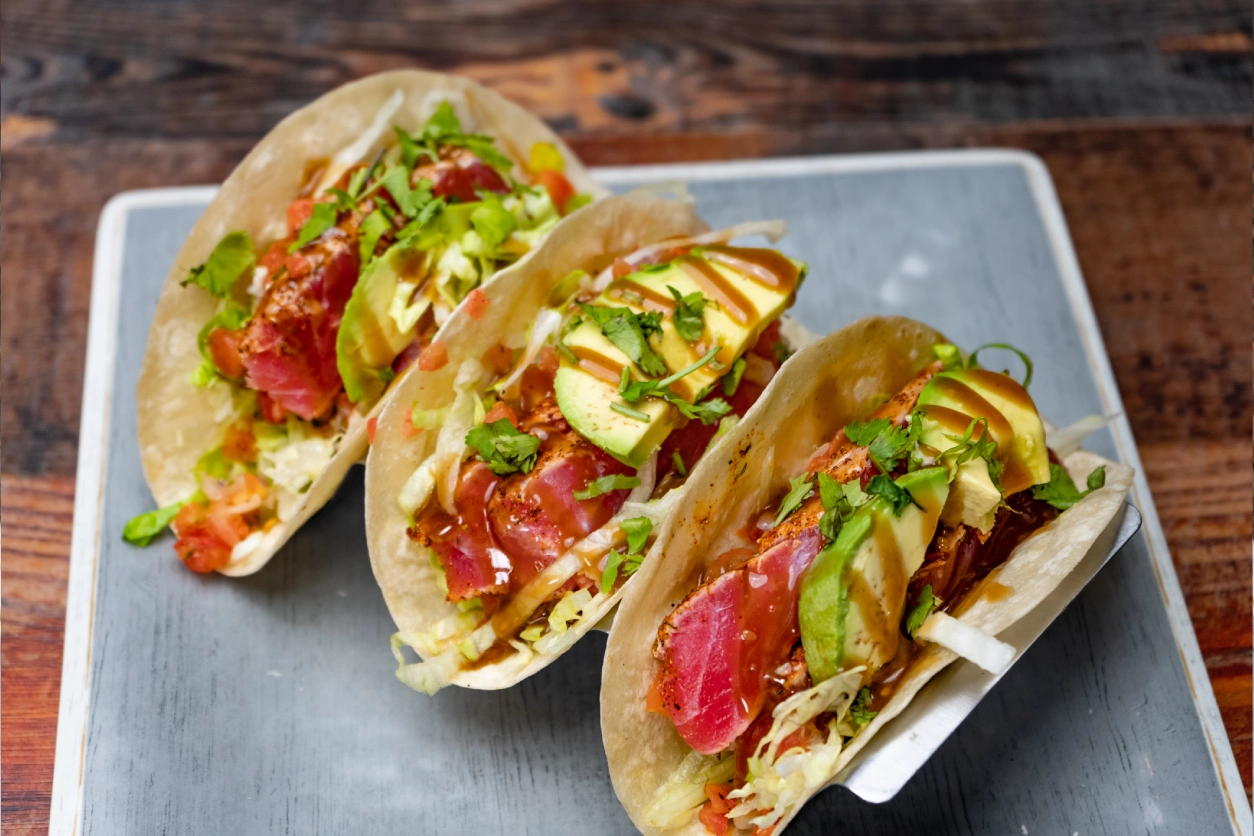 Three delicious tuna avocado tacos.