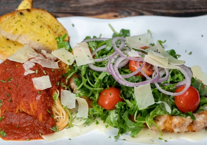Chicken parmesan, pasta, salad, garlic bread.