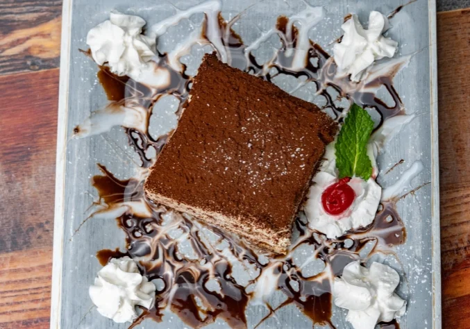Delicious tiramisu dessert with chocolate.