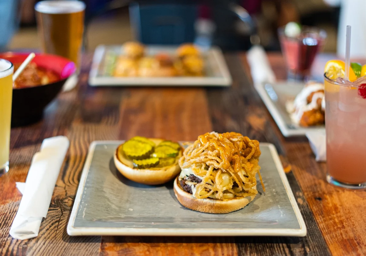 Burger with crispy onions and pickles.